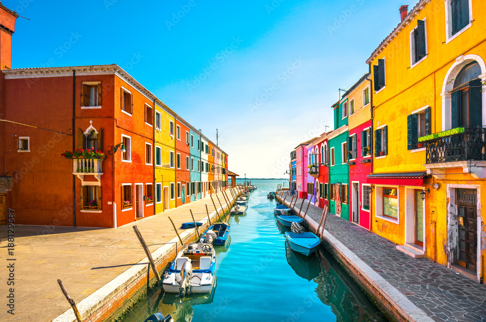 Fototapeta premium Venice landmark, Burano island canal, colorful houses and boats, Italy