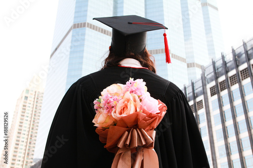 Female graduate with a bouquet of flowers
