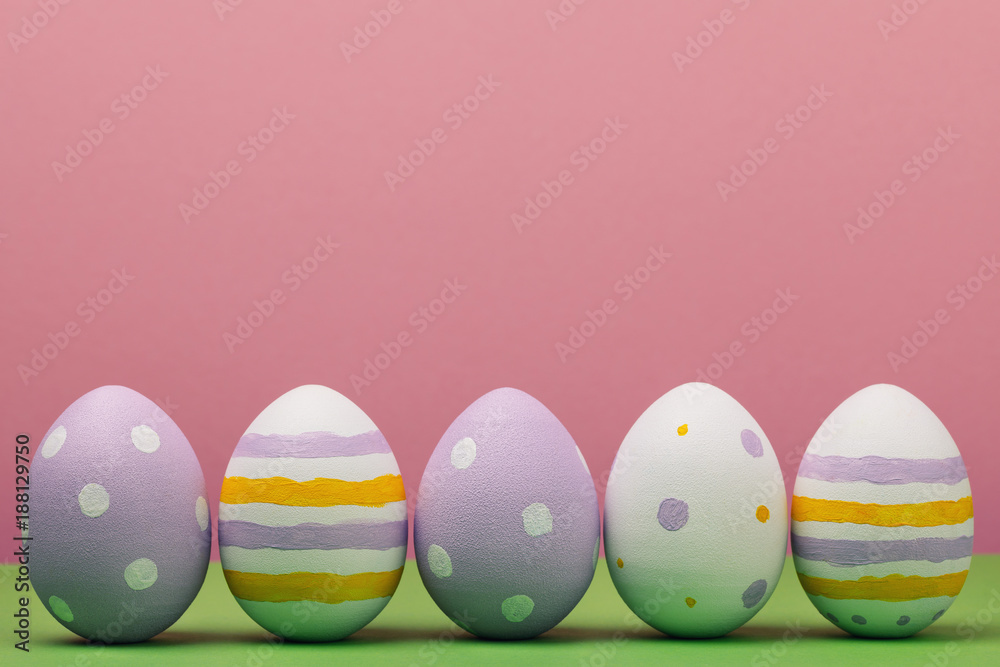 Easter eggs on a colored background with space for text, close-up Easter eggs on a colored background with space for text, close-up