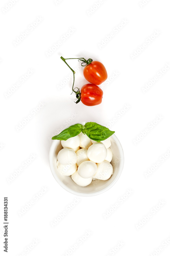 Two fresh Cherry tomatoes and Mozzarella cheese on a clean white background. Isolated.