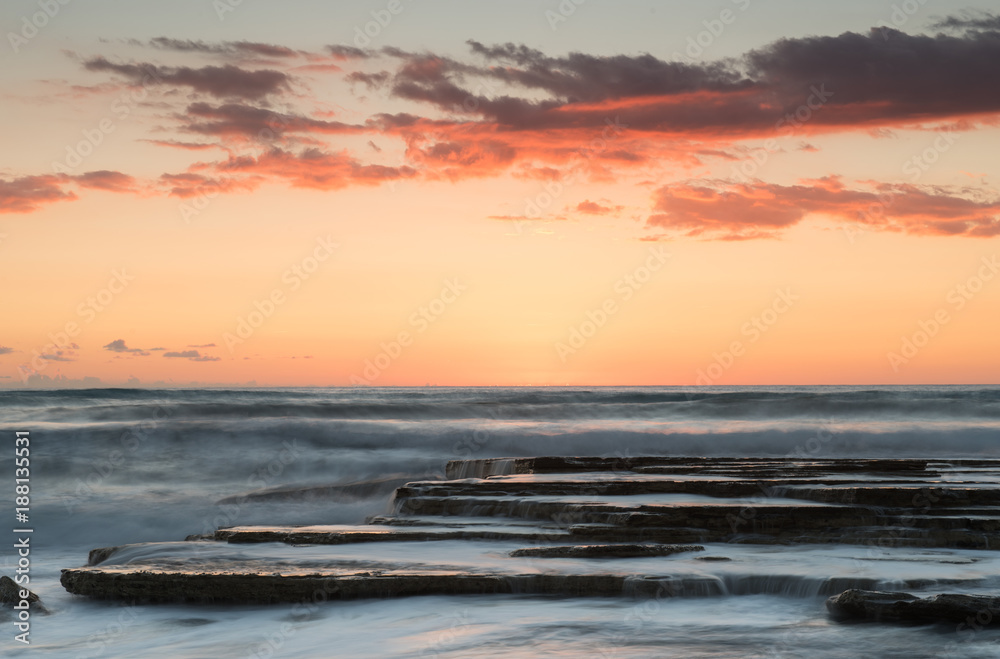 Beautiful dramatic Sunset over a rocky coast Beautiful dramatic Sunset over a rocky coast