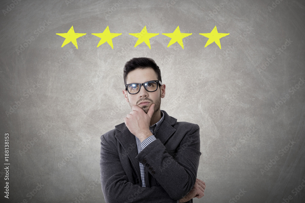 thoughtful businessman with stars, concept of success and leadership thoughtful businessman with stars, concept of success and leadership