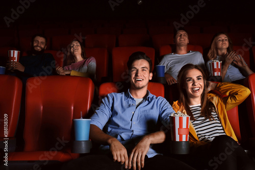 Young people watching movie in cinema photo