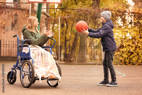Little girl in wheelchair a...