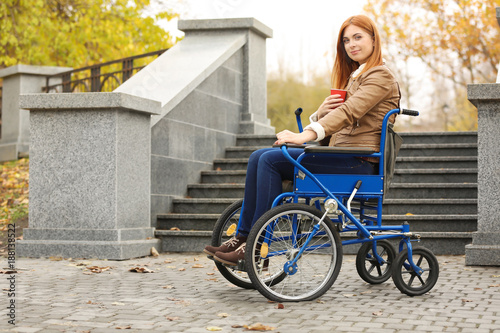 Young woman in wheelchair w...