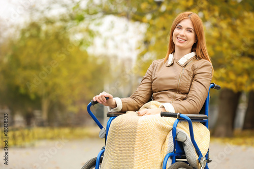 Young woman in wheelchair o...