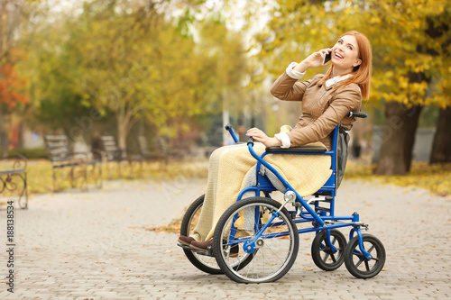 Young woman in wheelchair t...
