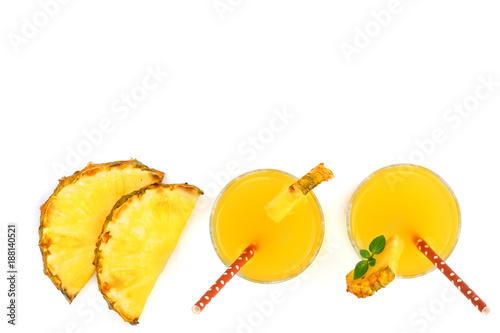 pineapple juice in a glass and pineapple slices isolated on white background with copy space for your text. Top view