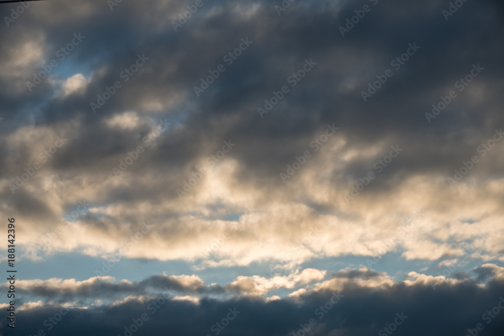 Background with dramatic thunderclouds on blue sky Background with dramatic thunderclouds on blue sky