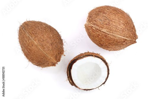 whole coconut with half isolated on white background. Flat lay. Top view