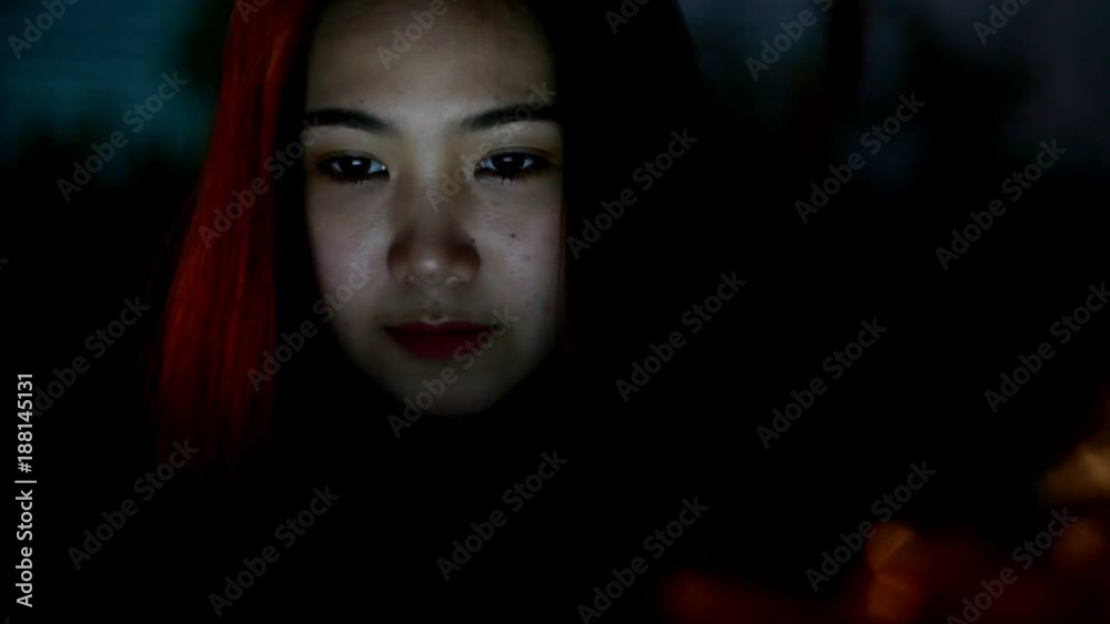 Beautiful woman using laptop and smiling in content 