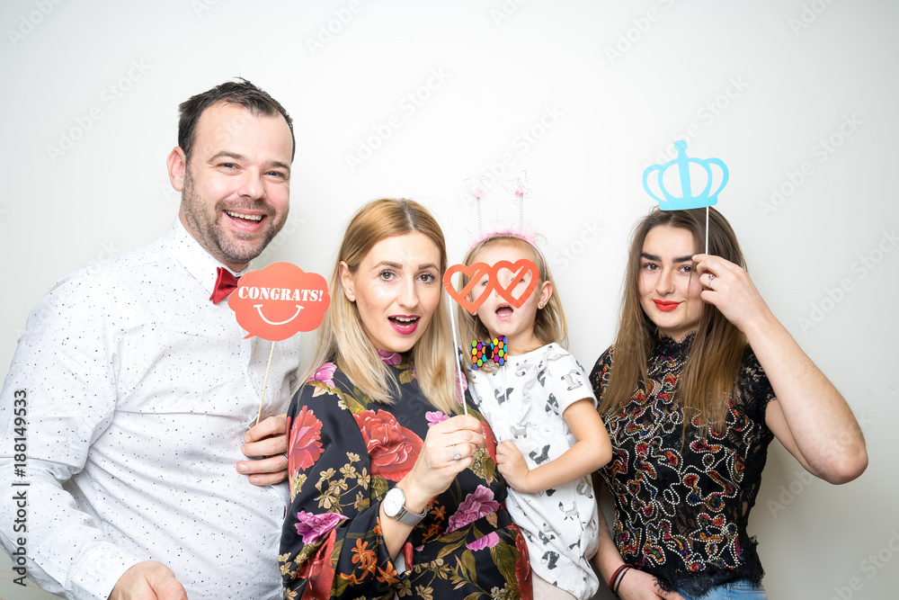 photo booth family dad mom daughter baby girl pose plain white background studio