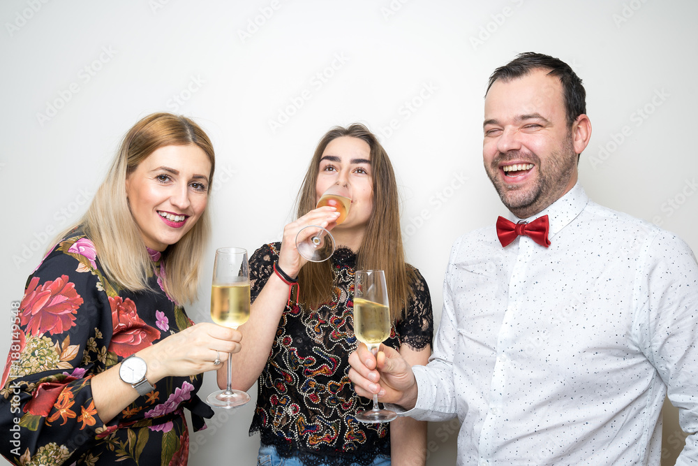 three people funny props pose photo booth happy fun bottle