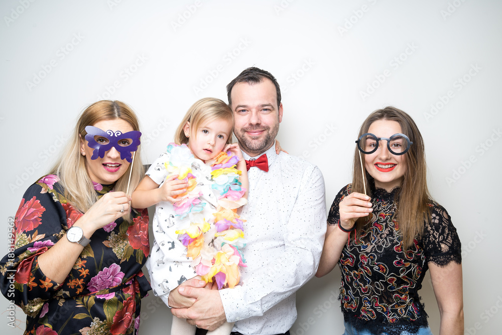 photo booth family dad mom daughter baby girl pose plain white background studio