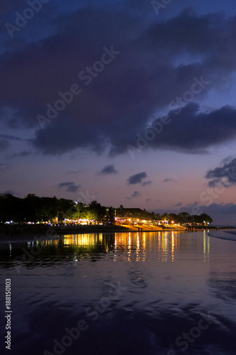 Night lights reflection after sunset at Kuta beach, Bali, Indonesia