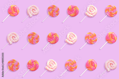 colorful lollipop candy isolated on violet background.