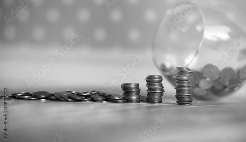 Coins in a jar on the floor. Accumulated coins on the floor. Sav