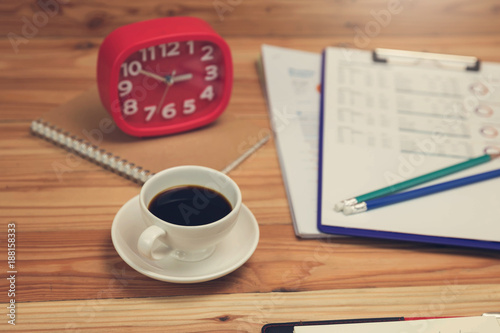 Business and finance concept of office working,Close up coffee on office desk in working hours