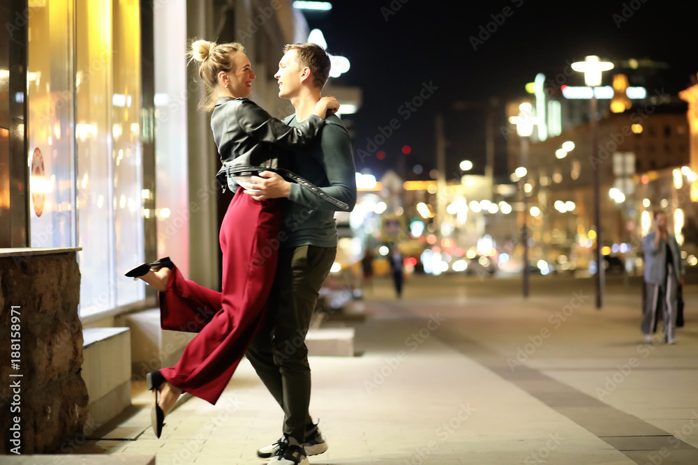 Beautiful couple on a date in a night city