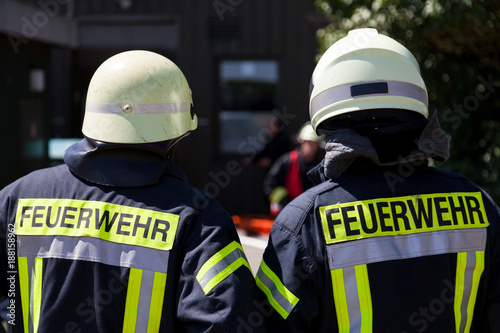 german fireman ( Feuerwehr ) stands near an accident