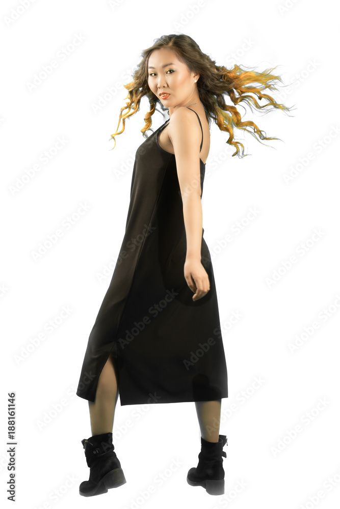 Fototapeta premium young elegant asian woman standing back and turning forvard, looking at the camera.