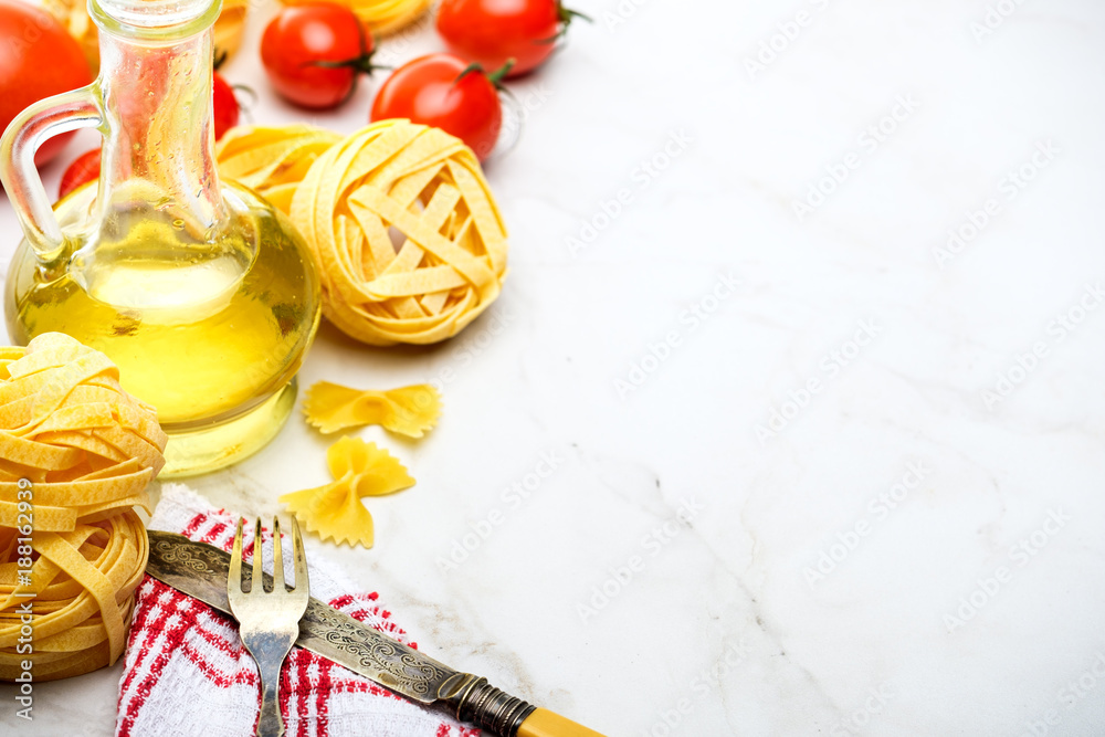Italian Pasta with tomatoes and olive oil on a white background. Copyspace