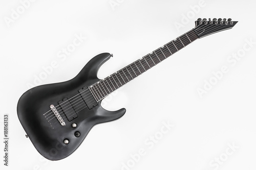 Black electric bass guitar isolated on white