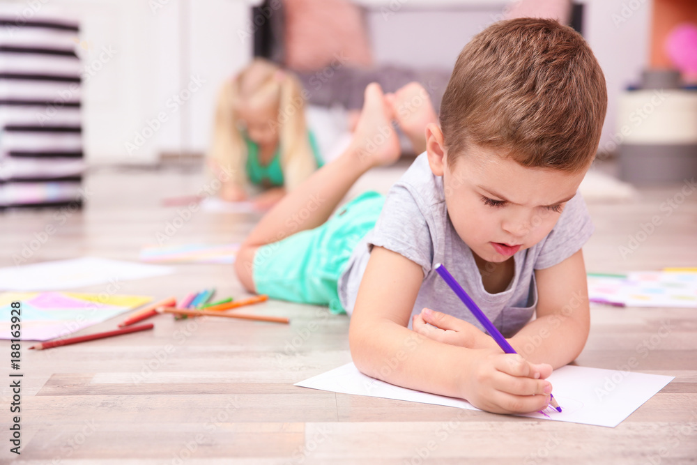 Cute little boy drawing at home Cute little boy drawing at home