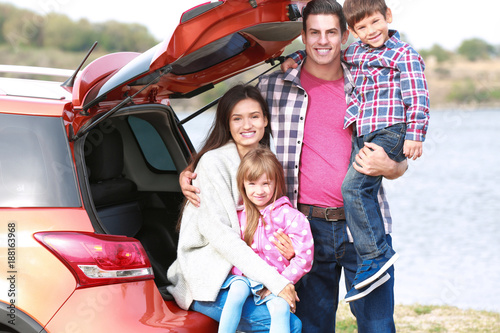 Happy family near car outdoors