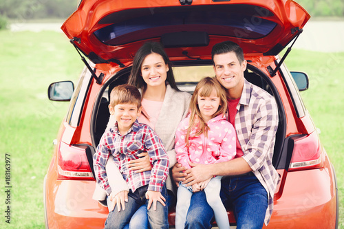 Happy family near car outdoors