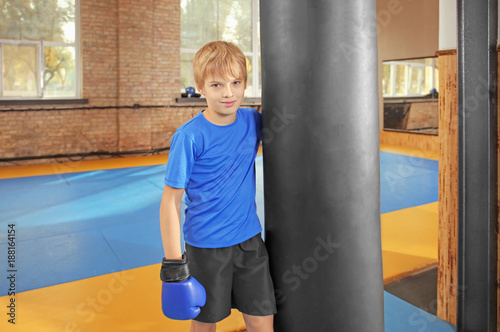 Cute little boy near punchb...