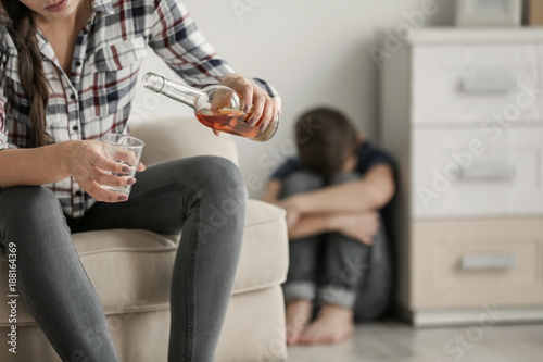 Young woman drinking alcoho...