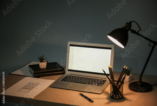 Принти на полотні Comfortable workplace with laptop on desk at home
