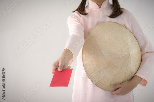 Vietnam woman holding red envelope, woman wear Vietnamese, Vietnamese new year photo