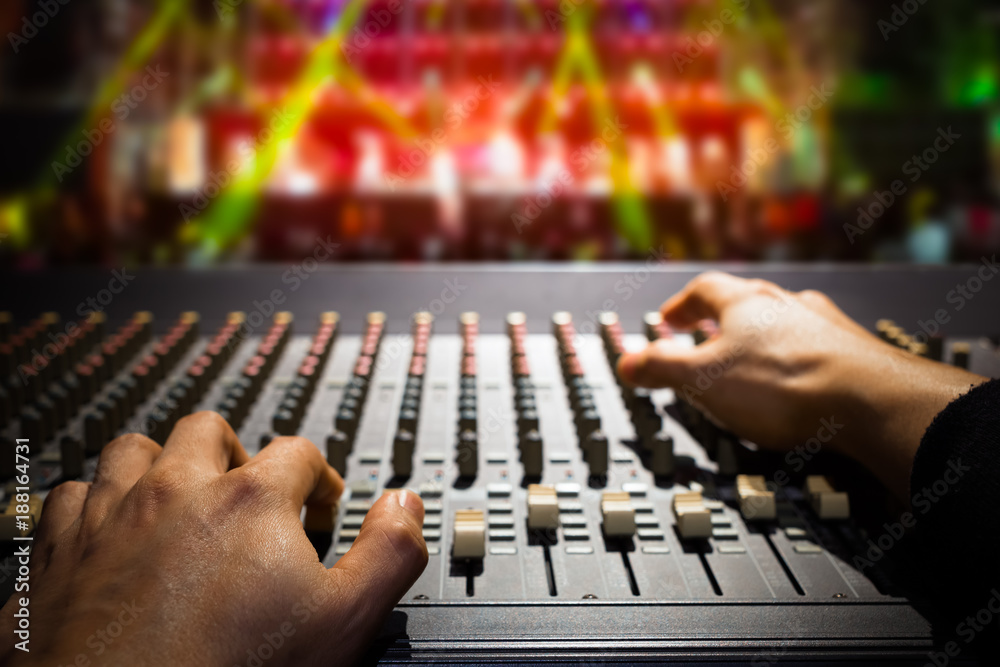 sound engineer hands working on sound mixer, background of concert stage Stock Photo | Adobe Stock sound engineer hands working on sound mixer, background of concert stage Stock Photo | Adobe Stock