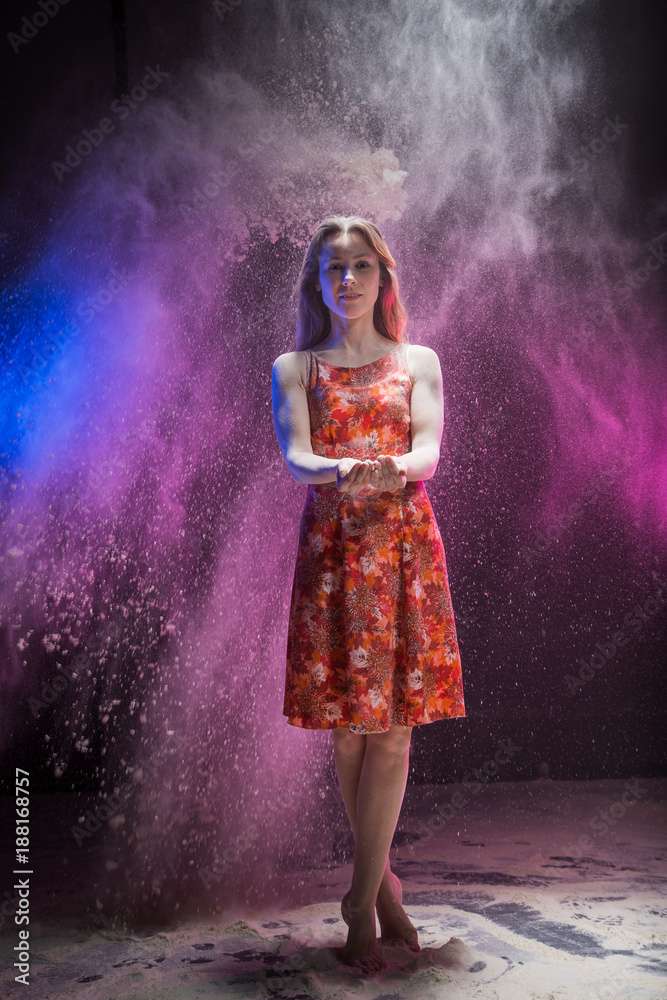 Young girl during photoshoot with flour
