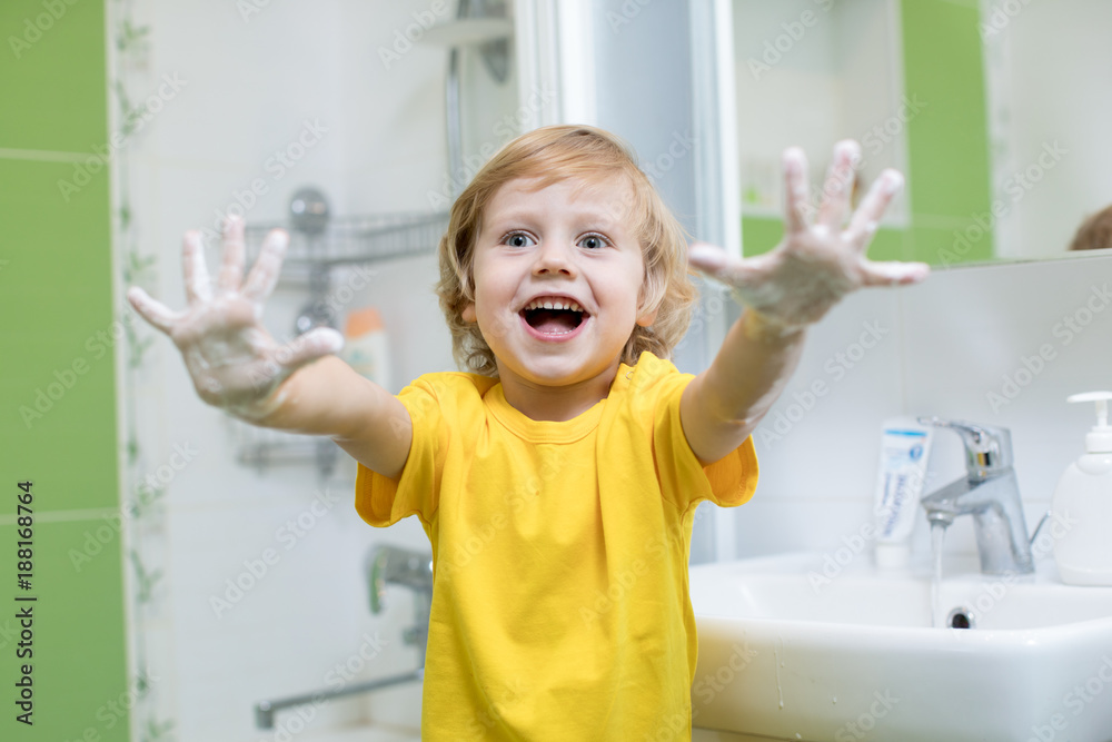 child washing hands and showing soapy palms Stock Photo Adobe Stock