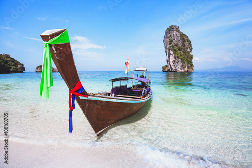 beautiful beach in Thailand, paradise landscape with turquoise blue clear water and wooden long-tail boat, summer holiday travel © Song_about_summer