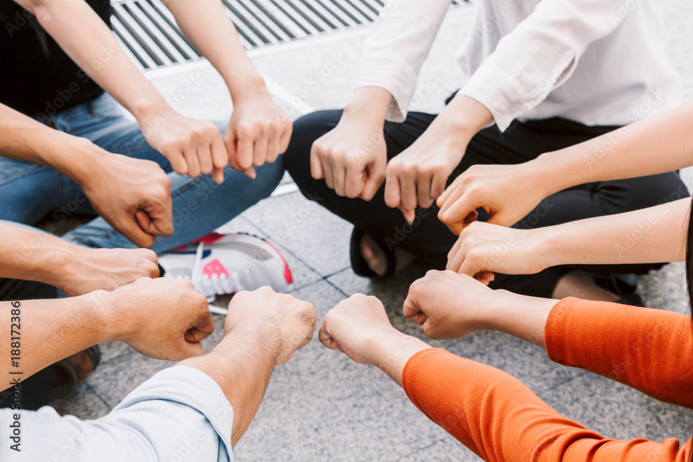 Fototapeta premium Group of team work people giving fist bump together.friendship concept