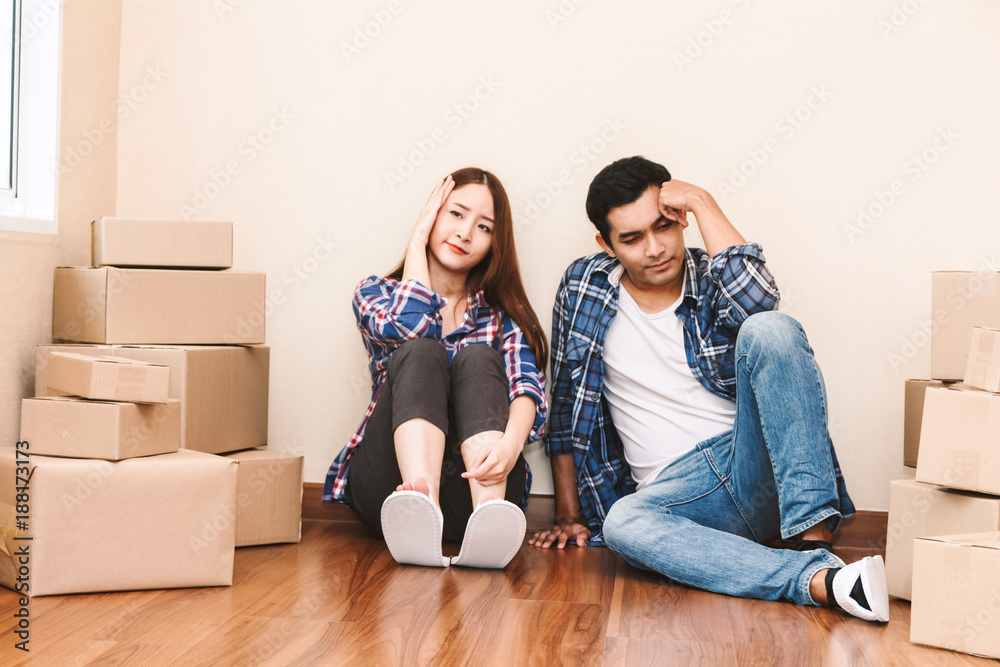 Young couple with cardboard box at home - Business online and delivery concept Young couple with cardboard box at home - Business online and delivery concept
