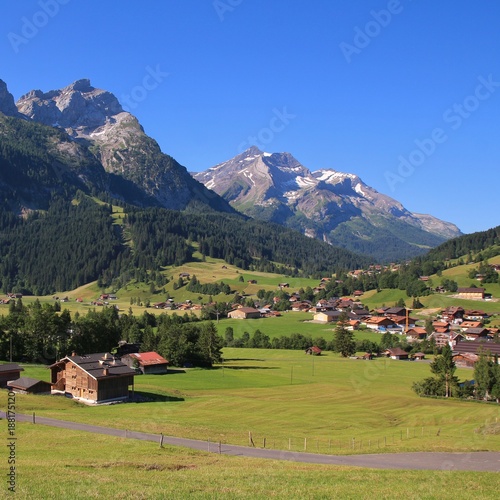 Village Gsteig bei Gstaad and high mountains. Summer day in Switzerland. photo