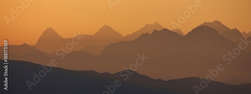 Golden sunrise near Gstaad. Summer morning in the Swiss Alps.