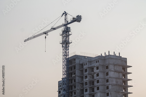 a crane over a new many-storeyed block of flats