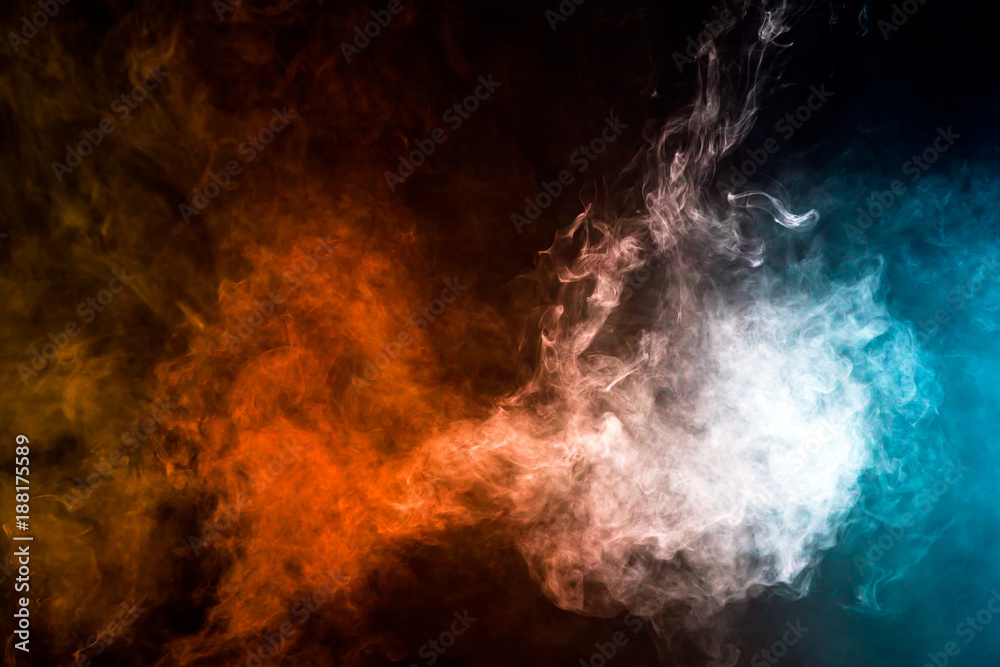 Fototapeta premium Colorful smoke clouds on dark background