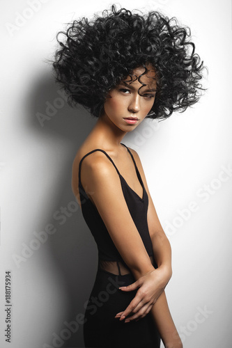 Beautiful woman with afro curls hairstyle