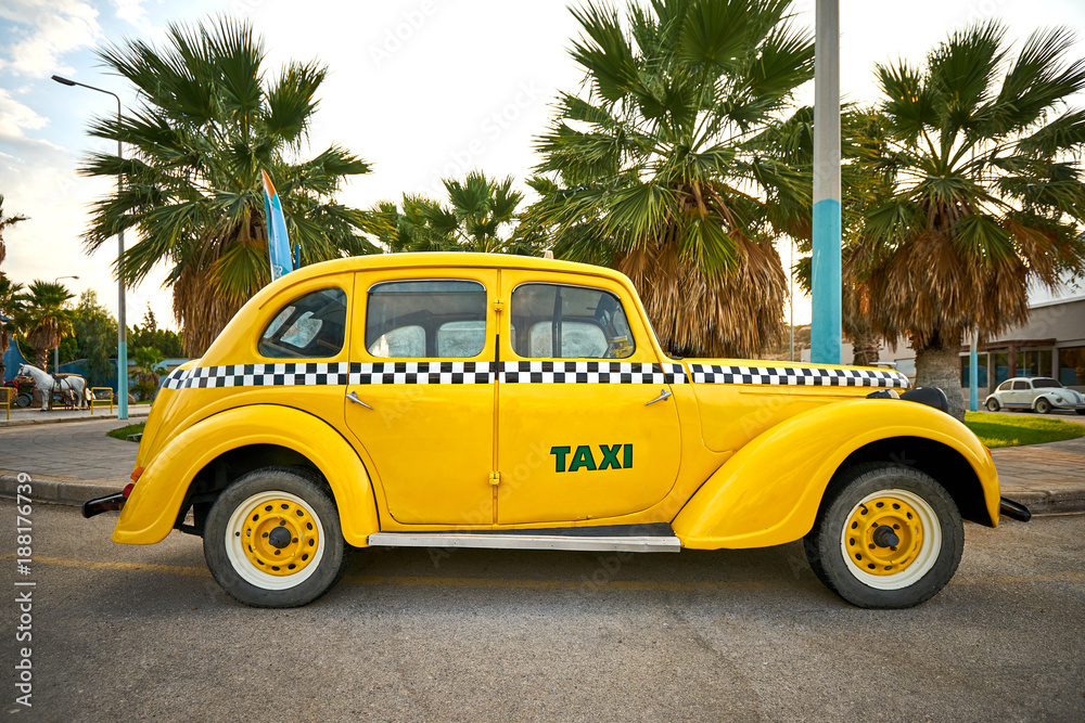 Yellow retro taxi car on the street