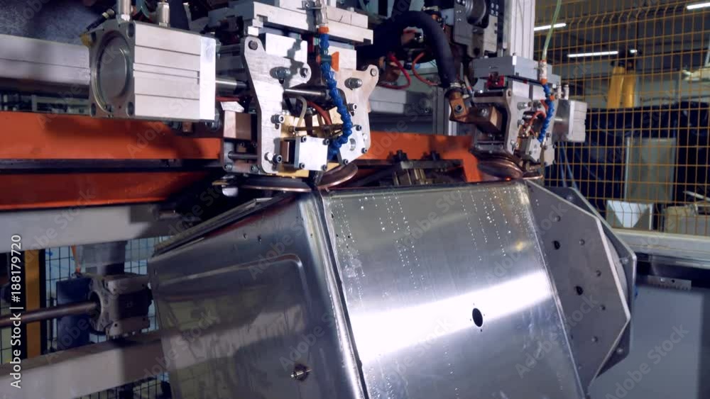 A side view on a steel box duringwelding process. A side view on a steel box duringwelding process.