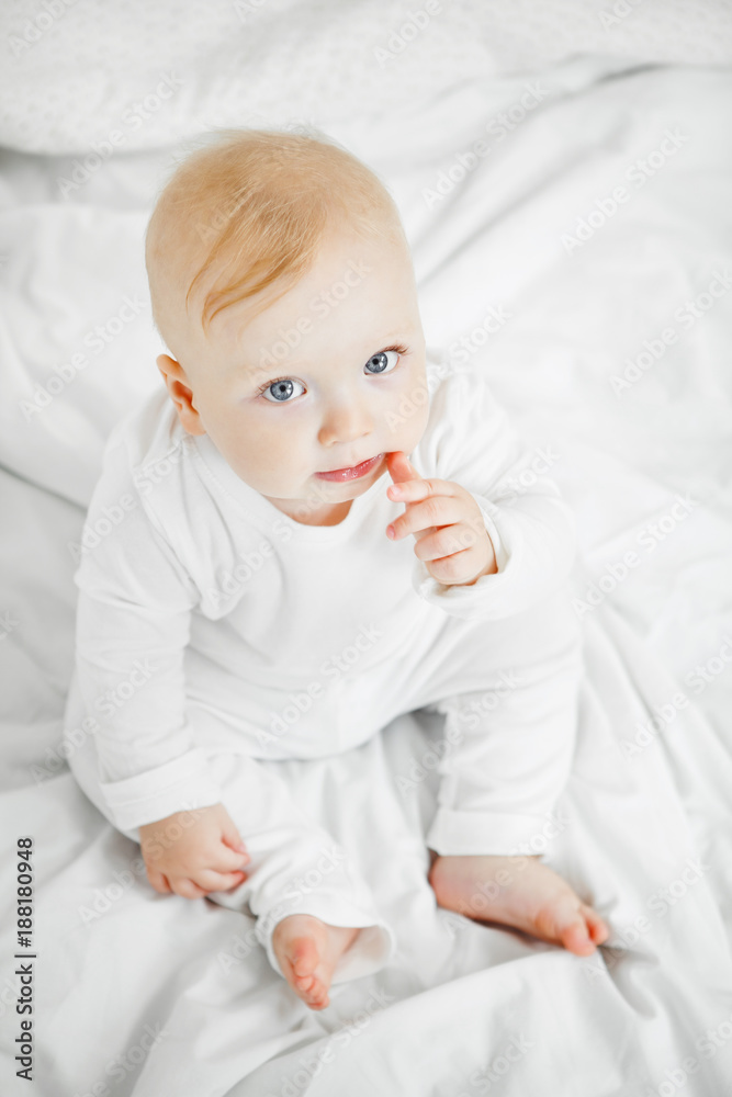 Charming baby with big kind eyes portrait from above Charming baby with big kind eyes portrait from above