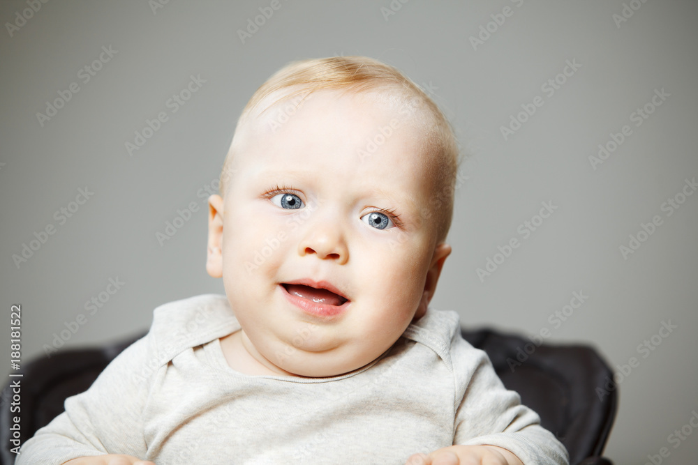 Baby boy with confused face expression portrait photo