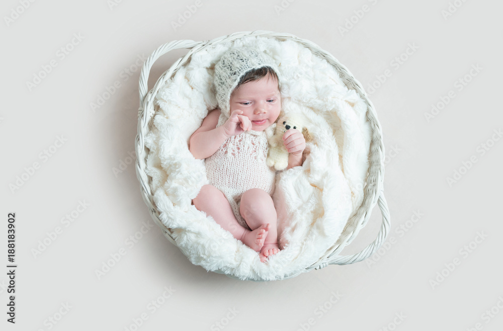 Newborn baby sleeping in wicker basket Newborn baby sleeping in wicker basket